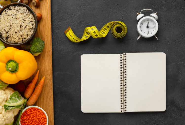 The Time-Tested Weight Loss Tools That Still Work Healthy foods, notebook, clock, measuring tape